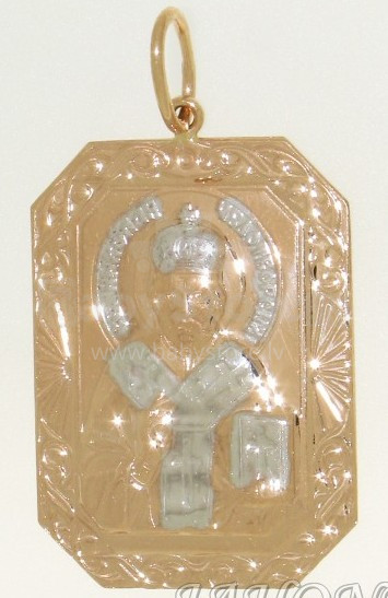 Золотой кулон - икона с изображением Николая Чудотворца.