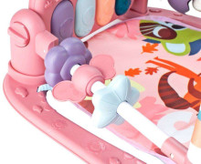Ikonka Art.KX5405 Mokomasis kilimėlis su pianinu ir barškučiais rožinės spalvos