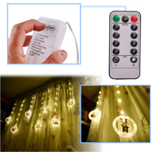 Ikonka Art.KX5249_1 LED gaismas Ziemassvētku bilžu aizkars apļos 3m 10 spuldzītes ar akumulatoru tālvadības pults